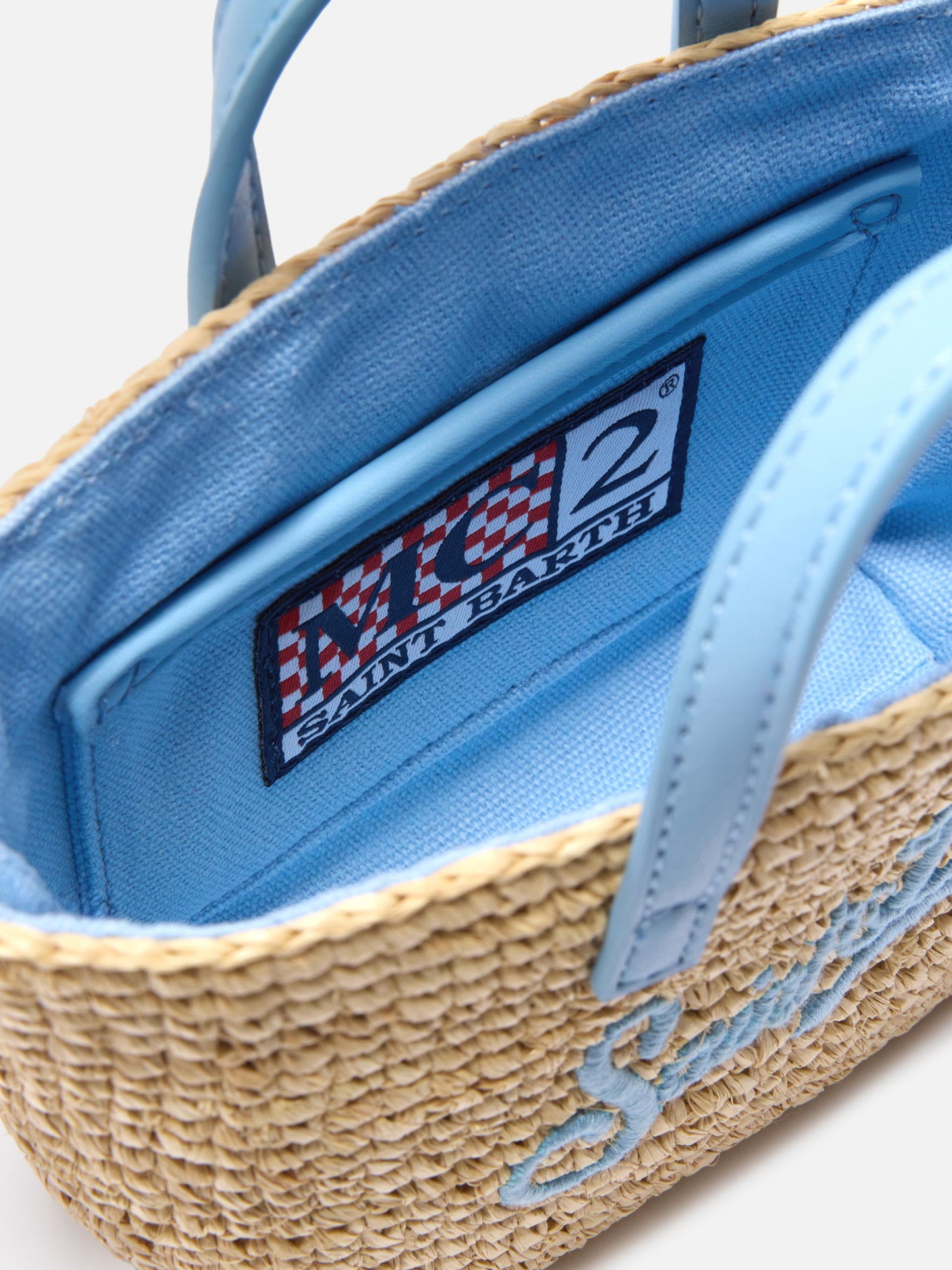 Micro City raffia bag with contrasting light blue embroidered logo