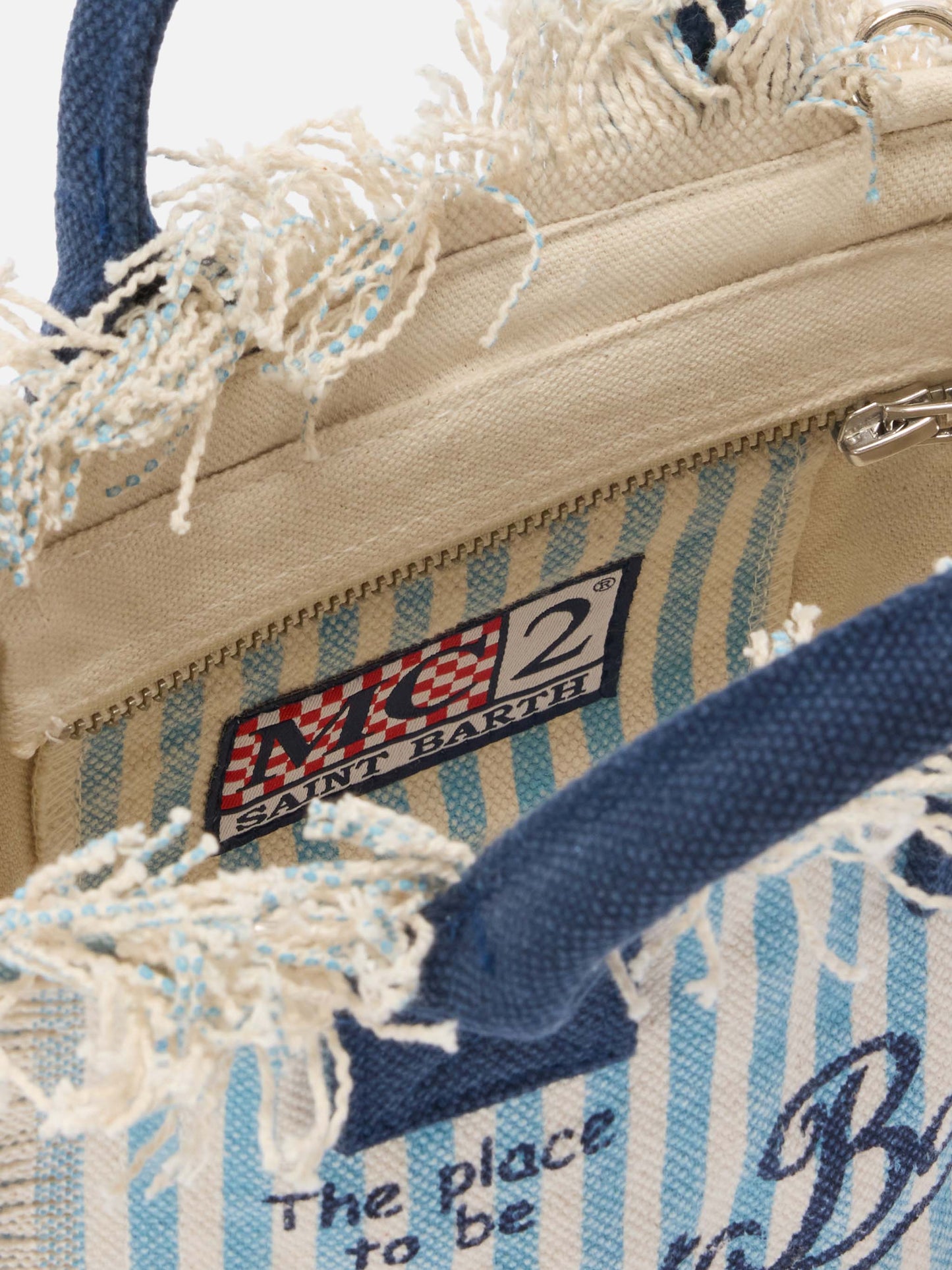 Neceser mini de lona con rayas azul claro y detalles en contraste