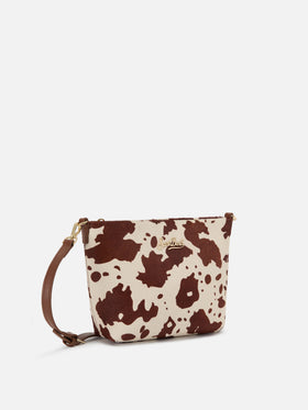 Sac Aline en pony hair imprimé vache avec plaque logo en métal 