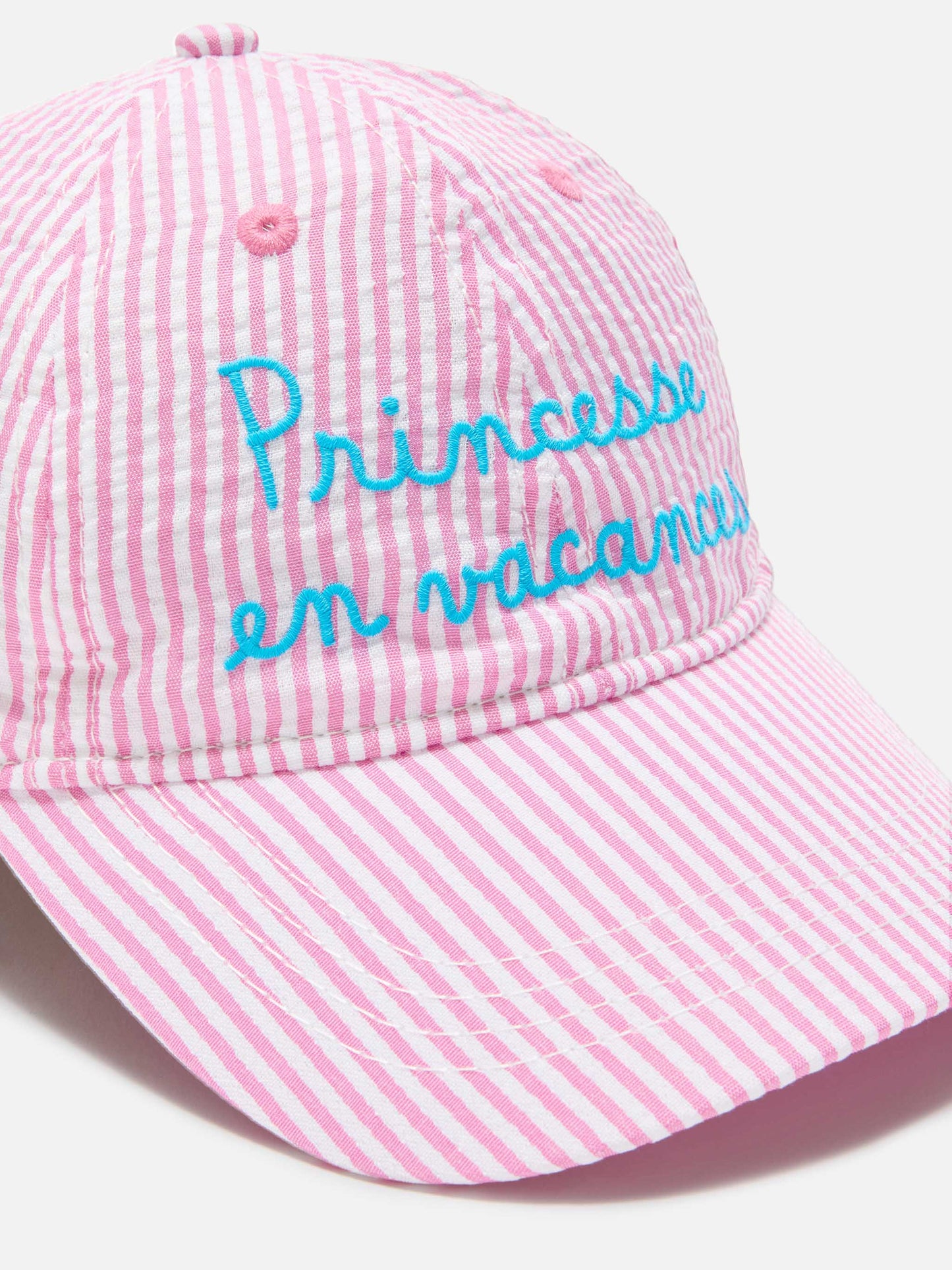 Baseball cap with visor in pink and white striped seersucker cotton with embroidery