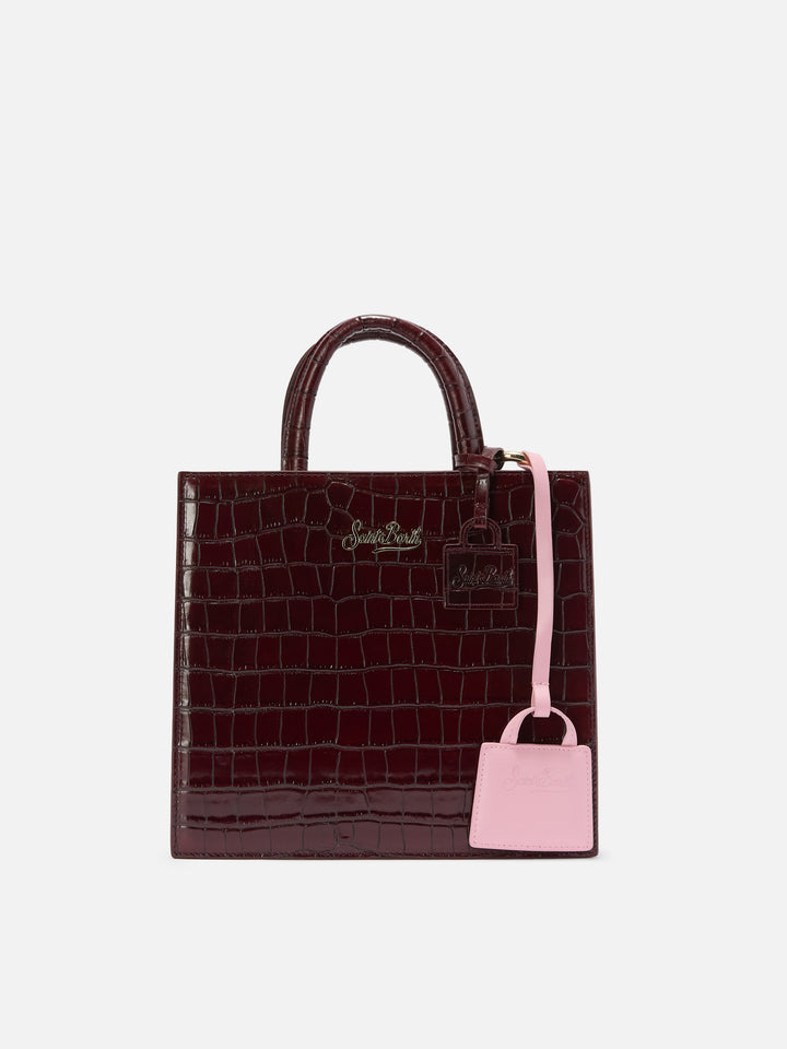 Light pink smooth leather bag charm with embossed logo