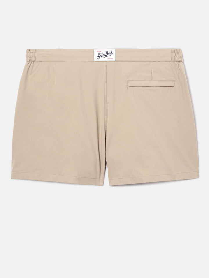 Capferrat swim shorts in solid beige with embroidered logo