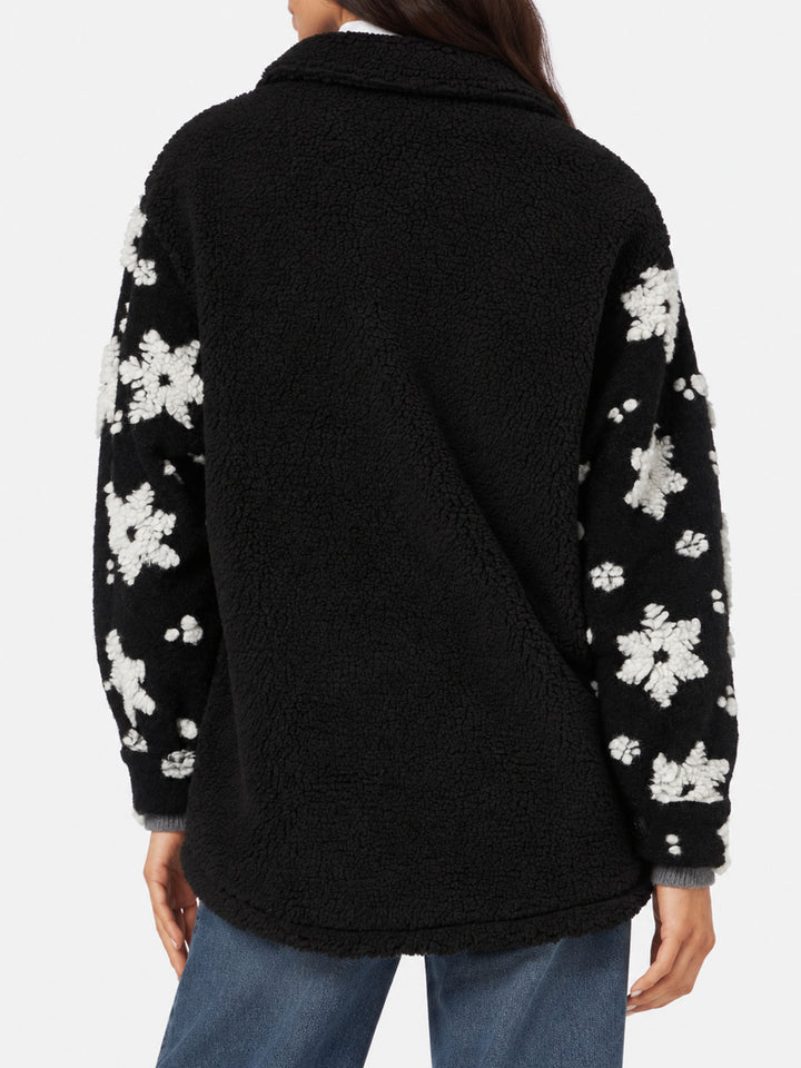 Giacca Elys in sherpa nera con fantasia fiocchi di neve