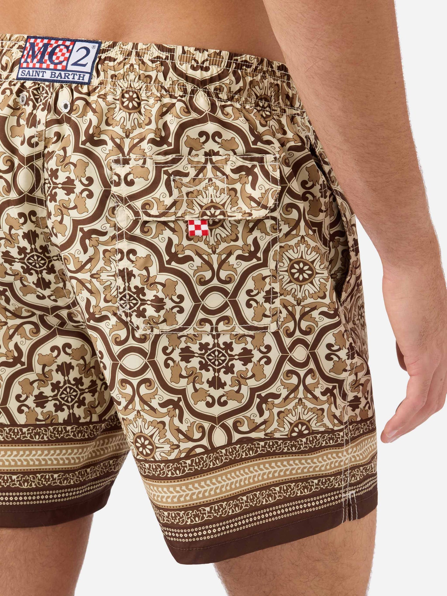 Gustavia swim shorts with brown ornamental placed print