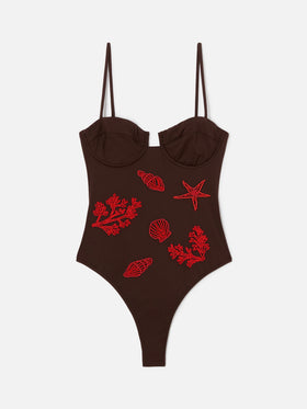 Medea one-piece swimsuit in brown with beaded sea-themed decorations