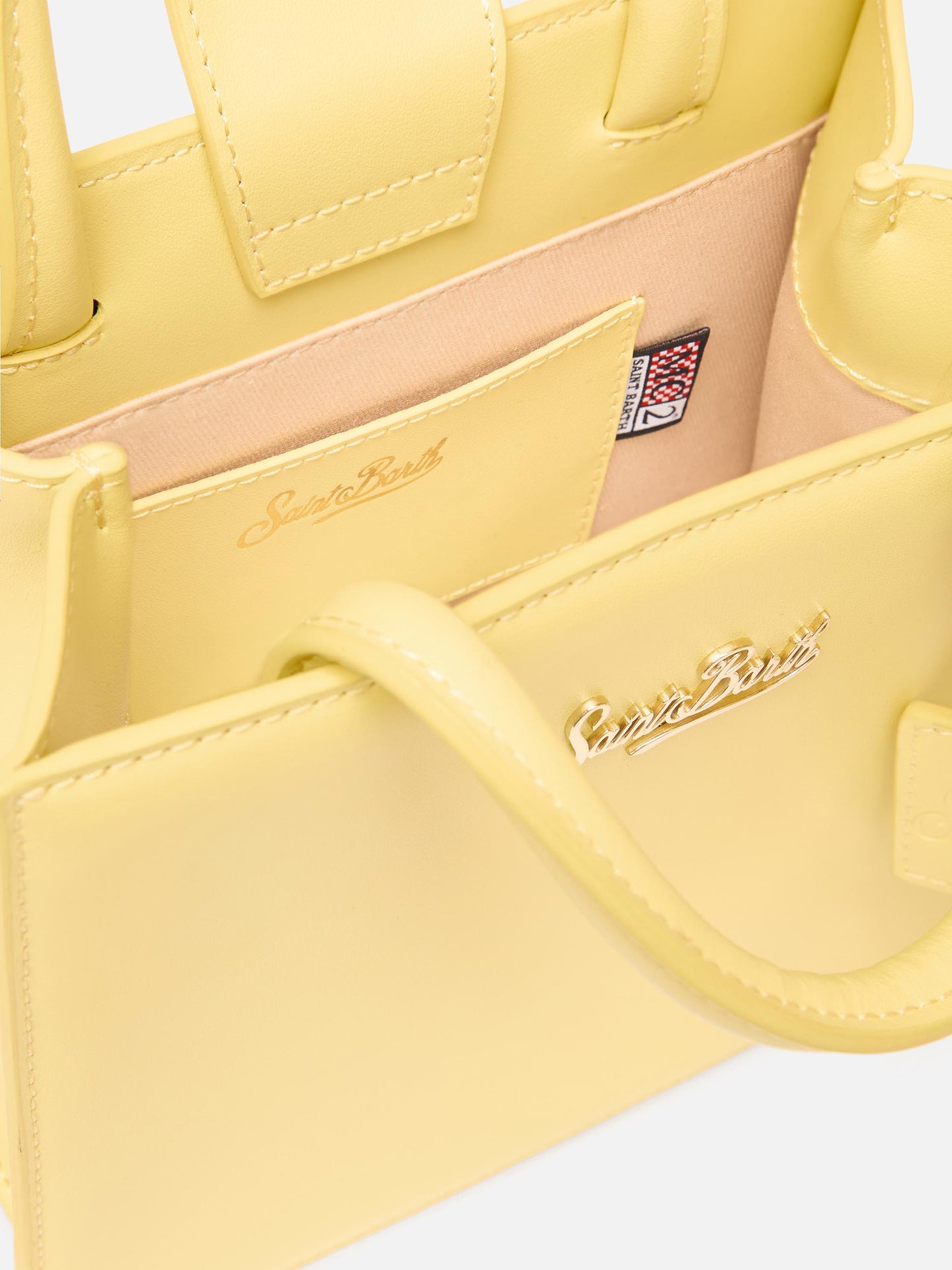 Structured Shop mini bag in butter yellow smooth leather with metal tag