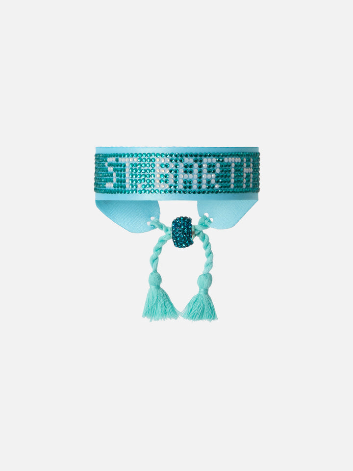 Light blue fabric bracelet with St. Barth beaded lettering